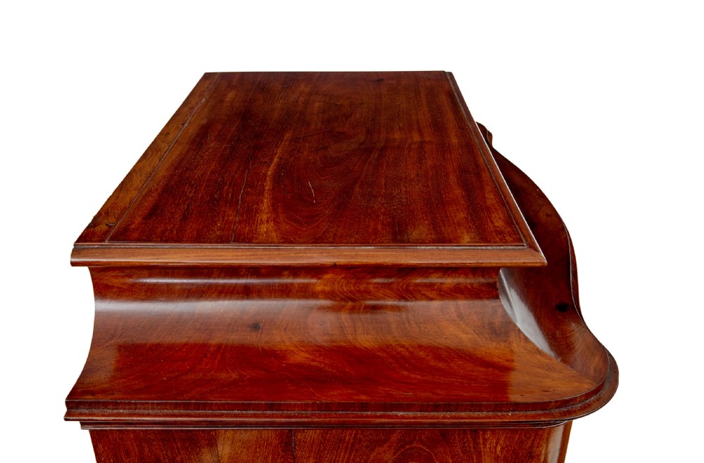 A pair of 19th-century Scandinavian tall mahogany cupboards featuring serpentine fronts, flame veneer panels, and ornate brass keyhole escutcheons. View XII