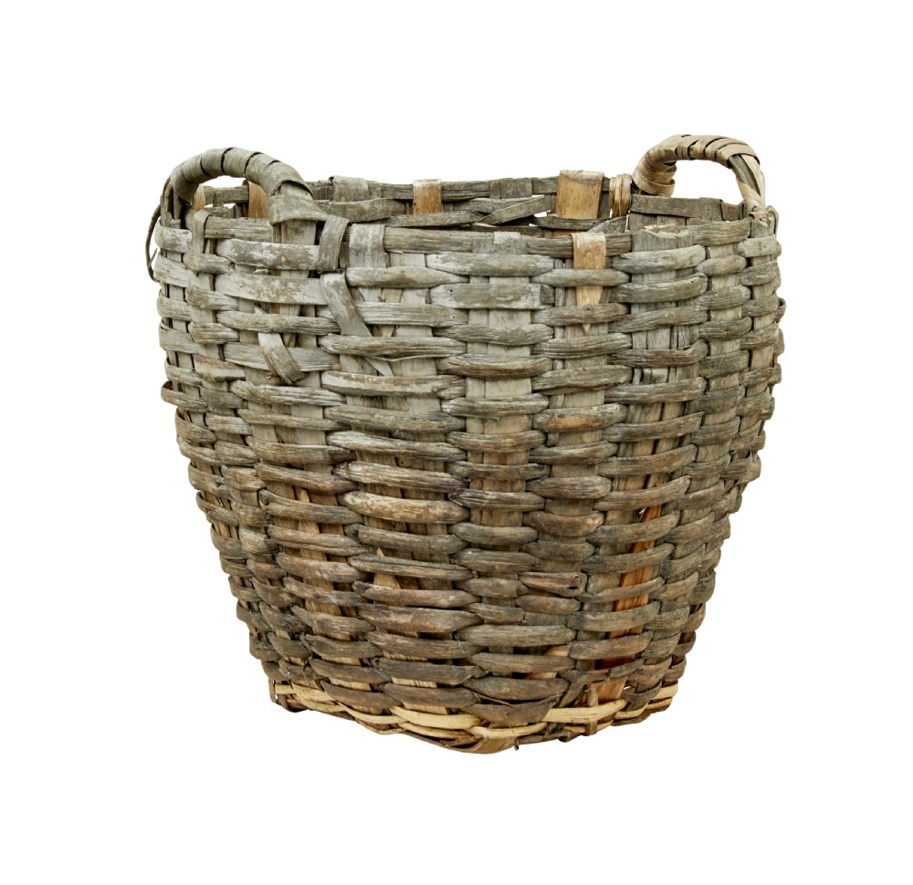 A large, weathered hand-woven basket made from thick grey pine splints with two integrated woven handles at the top rim. View IV