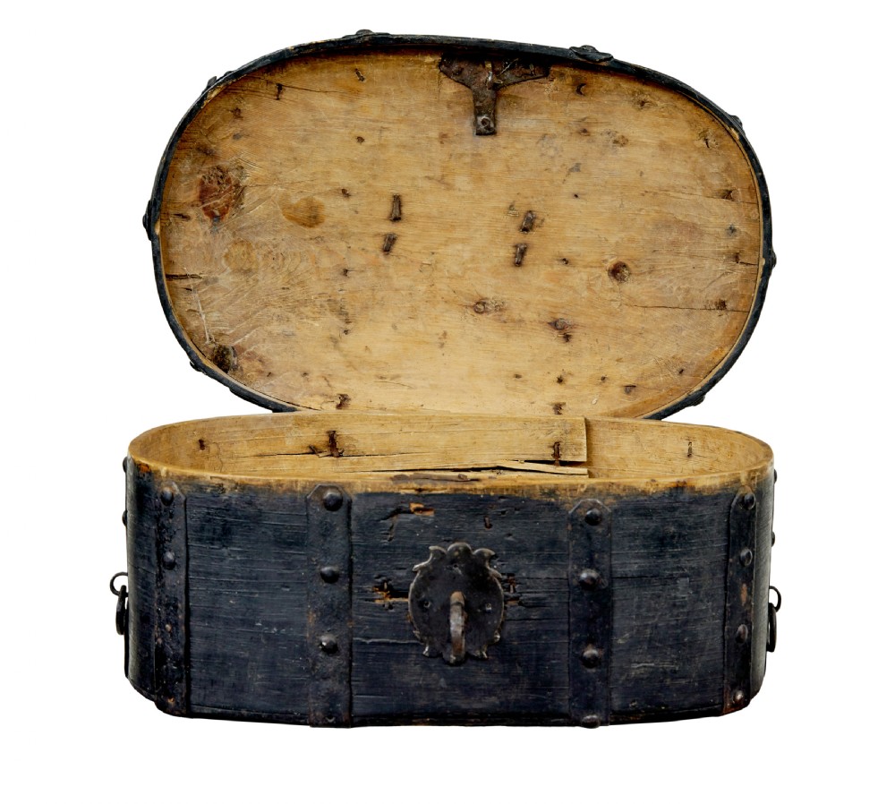A 19th-century oval black-painted pine box featuring heavy iron straps, rivets, a top handle, and a decorative keyhole escutcheon. View II