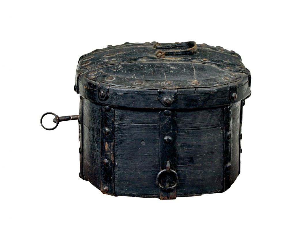 A 19th-century oval black-painted pine box featuring heavy iron straps, rivets, a top handle, and a decorative keyhole escutcheon. View III