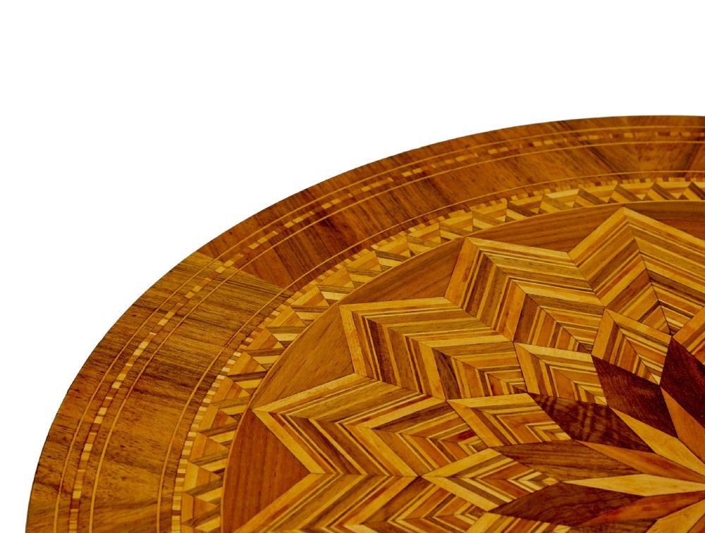A 19th-century Italian Sorrento table featuring a circular top with geometric marquetry, a turned central column stem, and carved tripod legs. View V