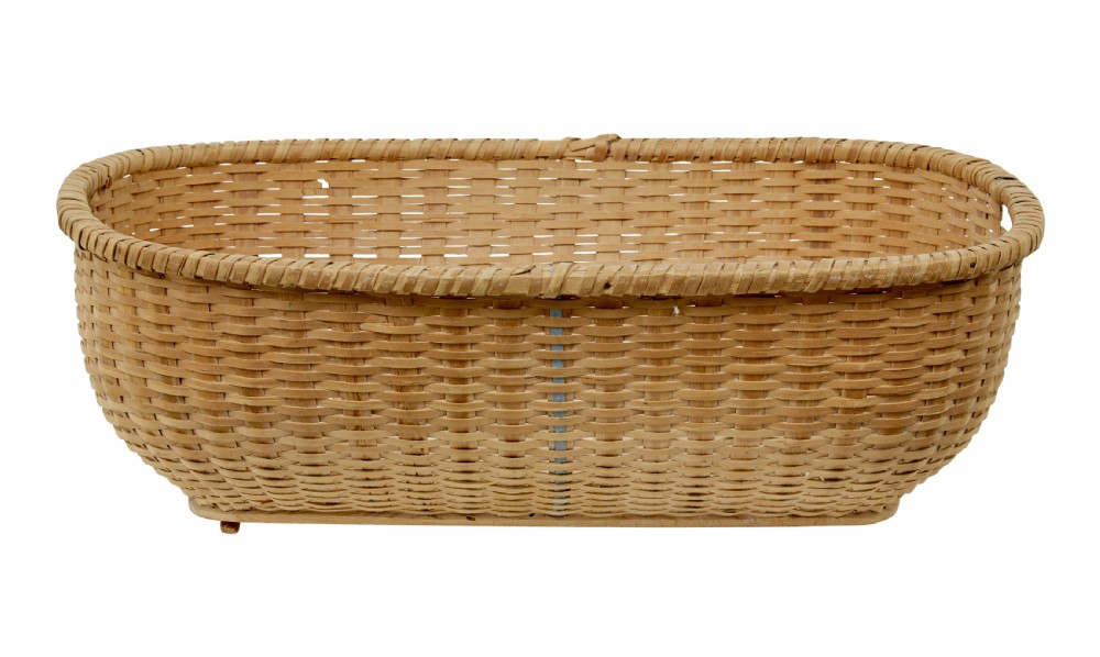 A large oval hand-woven pine basket with integrated handles and a reinforced wooden base. View IV