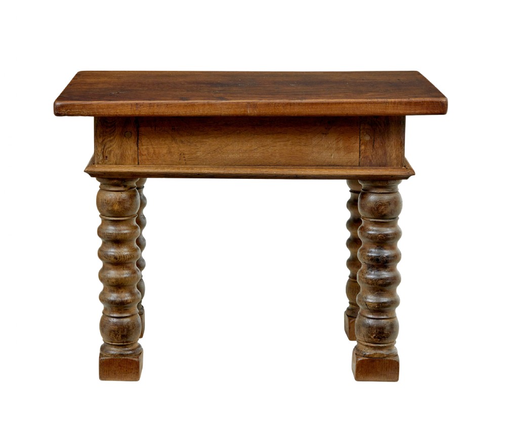 A 19th-century Dutch oak side table featuring a rectangular top and four thick turned legs with square block feet. View II