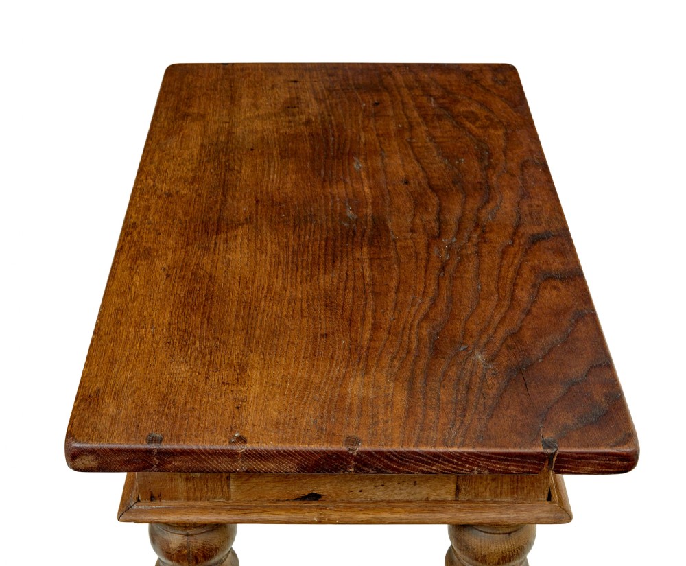 A 19th-century Dutch oak side table featuring a rectangular top and four thick turned legs with square block feet. View VI