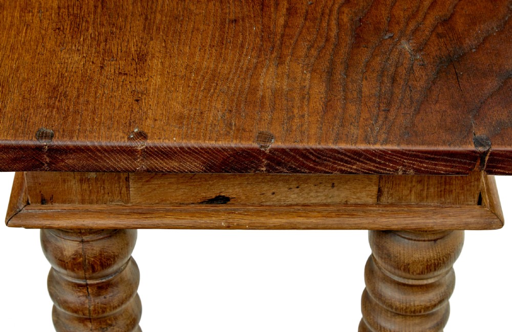 A 19th-century Dutch oak side table featuring a rectangular top and four thick turned legs with square block feet. View VII