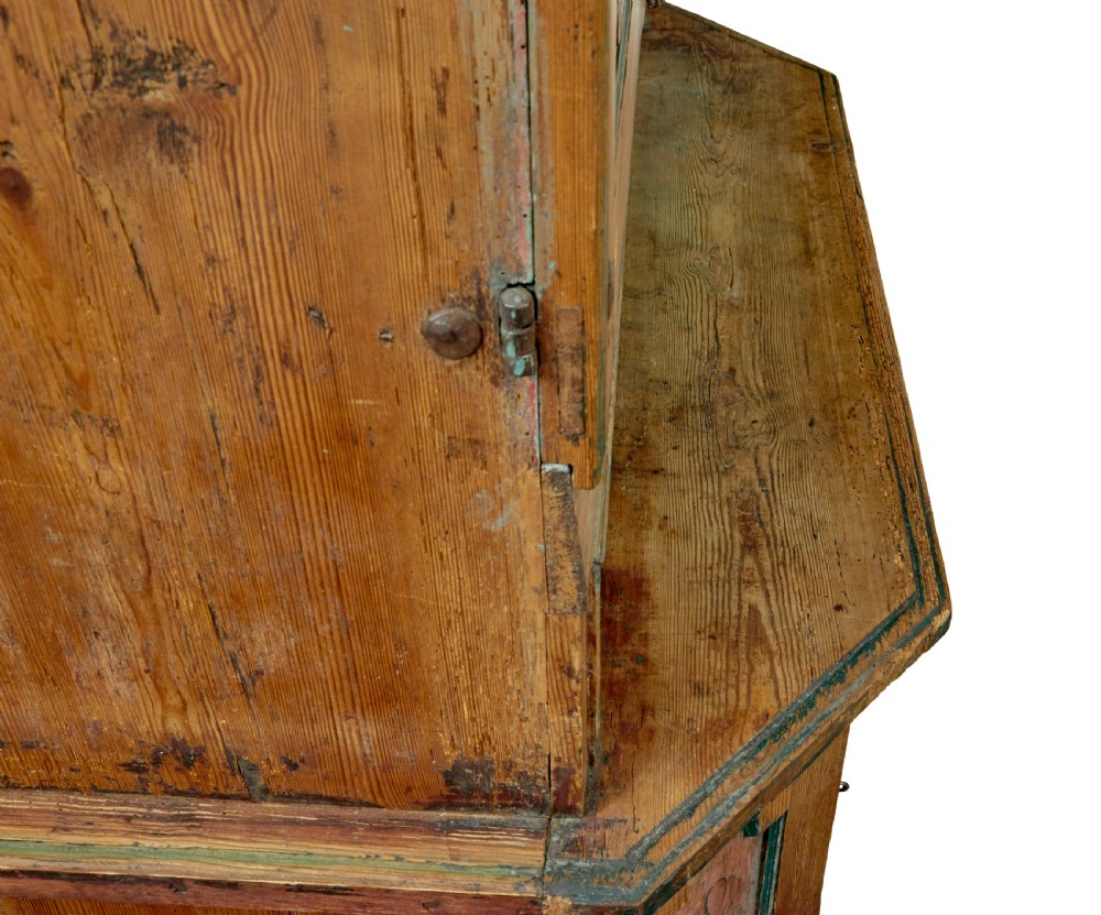 An early nineteenth-century Swedish painted pine cupboard featuring a shaped upper section with painted panel doors dated 1813 above an open shelf and lower cabinet. View VII