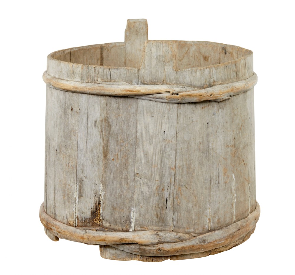A large round 19th-century Scandinavian pine storage barrel featuring vertical stave timber construction and thick wooden binding hoops around the top and bottom. View II