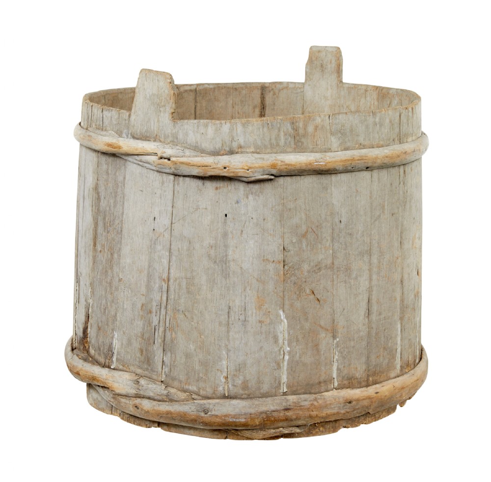 A large round 19th-century Scandinavian pine storage barrel featuring vertical stave timber construction and thick wooden binding hoops around the top and bottom. View III