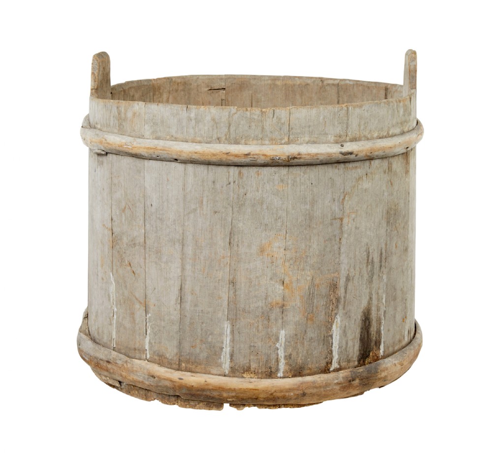 A large round 19th-century Scandinavian pine storage barrel featuring vertical stave timber construction and thick wooden binding hoops around the top and bottom. View IV