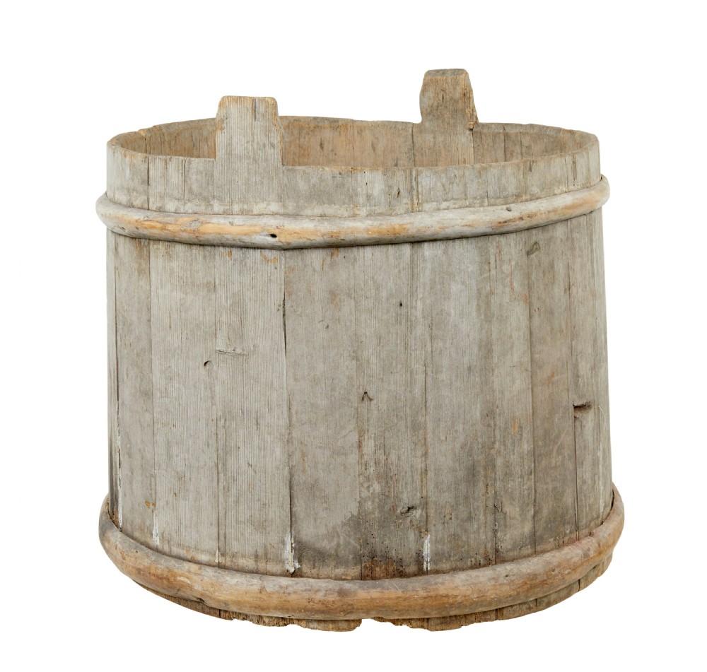 A large round 19th-century Scandinavian pine storage barrel featuring vertical stave timber construction and thick wooden binding hoops around the top and bottom. View VI