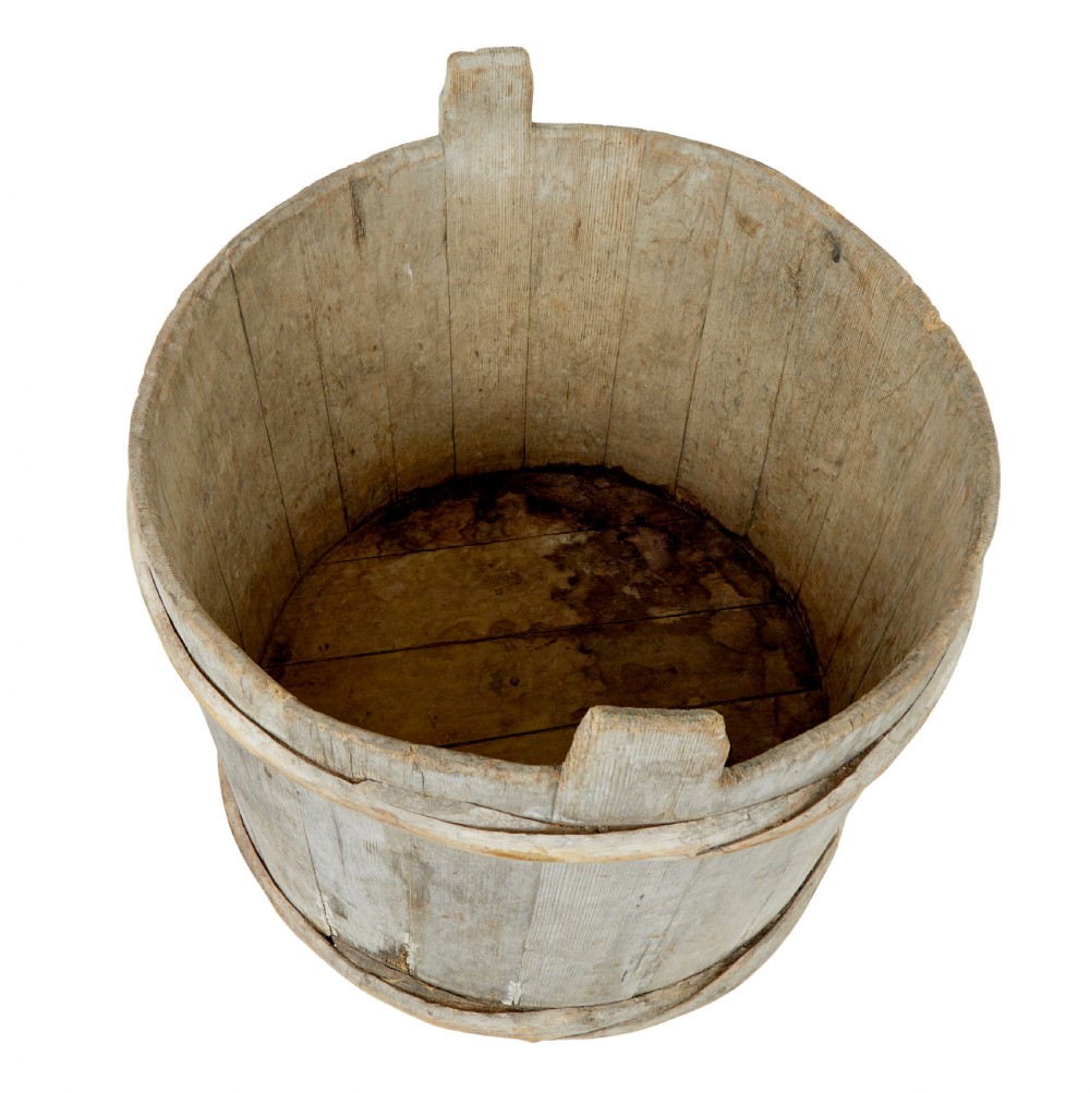 A large round 19th-century Scandinavian pine storage barrel featuring vertical stave timber construction and thick wooden binding hoops around the top and bottom. View IX