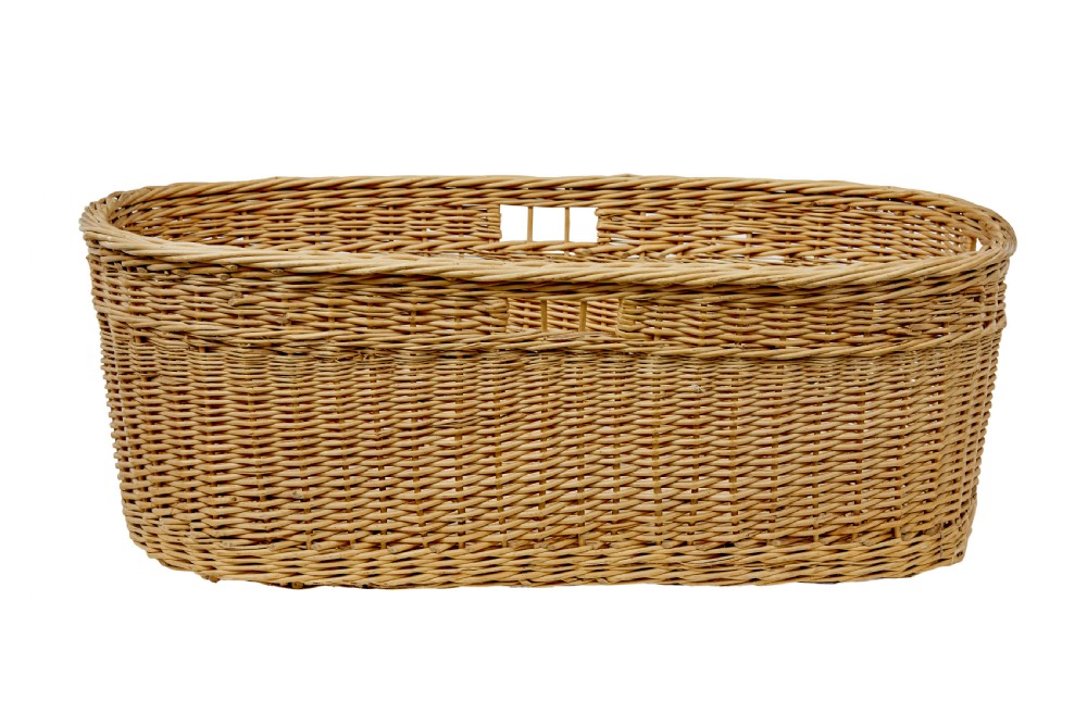 An oval hand-woven natural wicker basket featuring tight weave patterns and integrated cut-out handles near the upper rim.