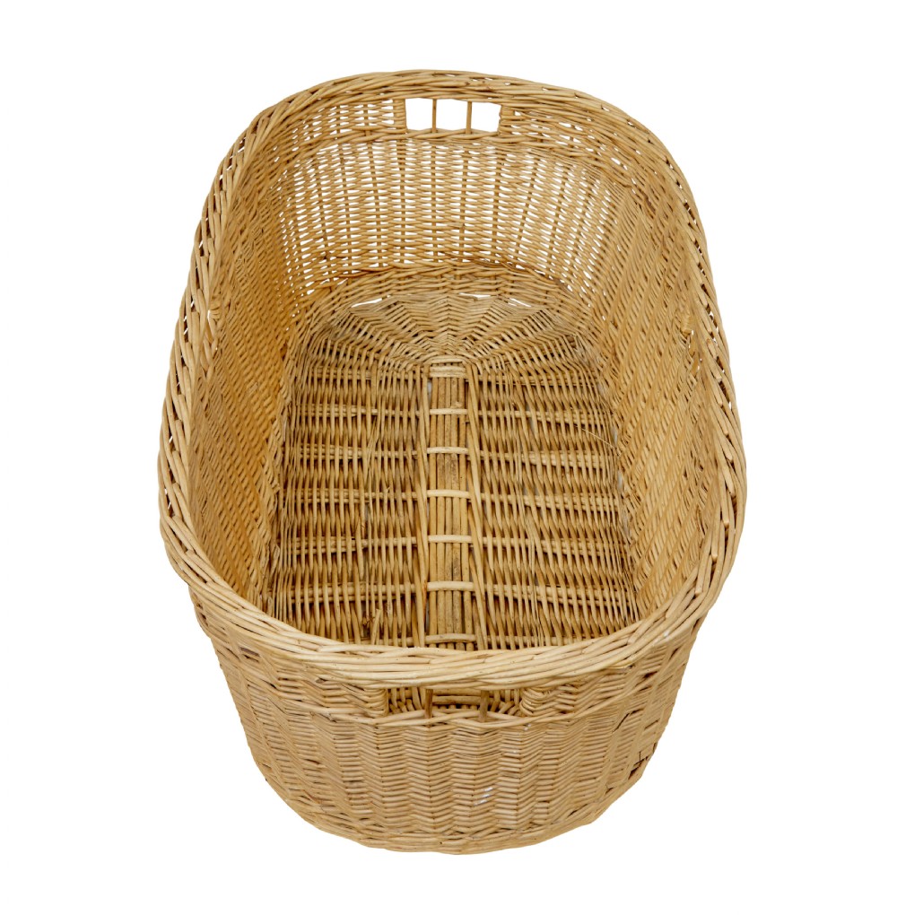 An oval hand-woven natural wicker basket featuring tight weave patterns and integrated cut-out handles near the upper rim. View III