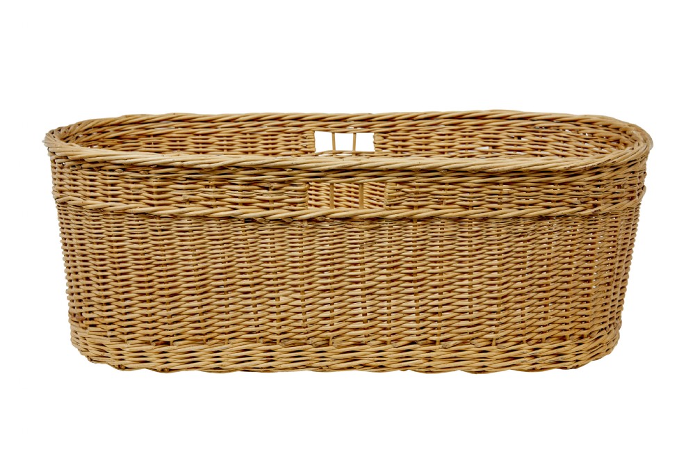 An oval hand-woven natural wicker basket featuring tight weave patterns and integrated cut-out handles near the upper rim. View VII