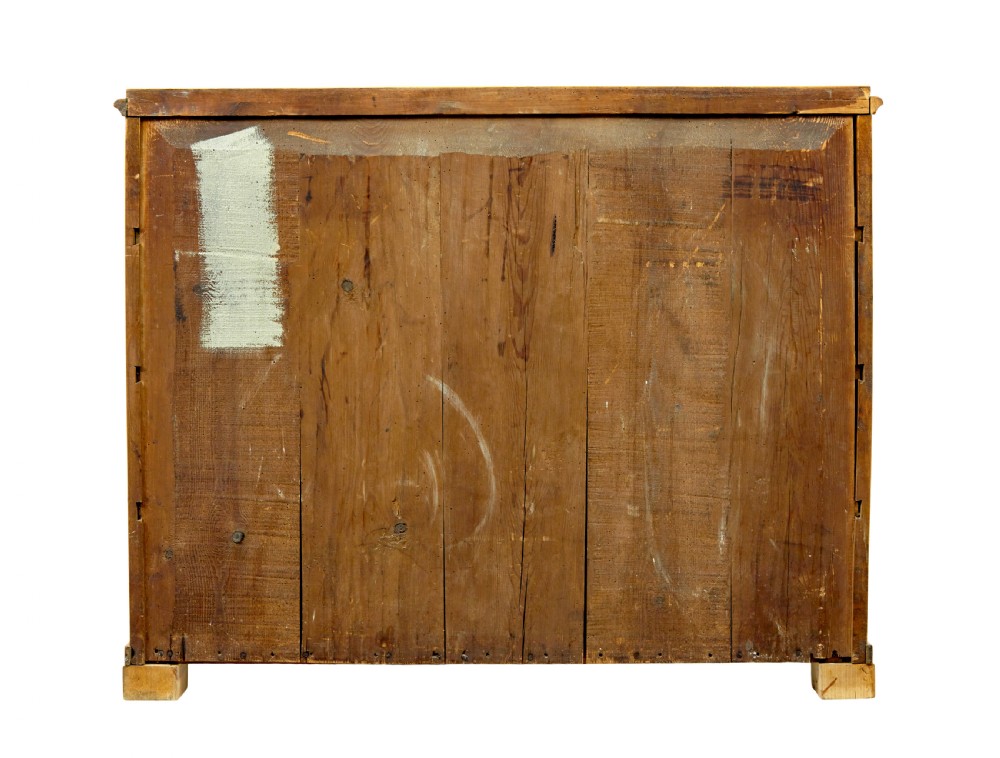 A nineteenth-century Scandinavian chest of drawers crafted from golden birch with four wide drawers and keyhole escutcheons. View VIII