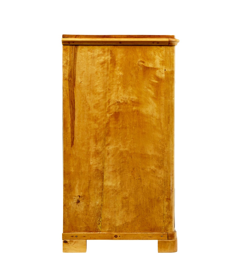 A nineteenth-century Scandinavian chest of drawers crafted from golden birch with four wide drawers and keyhole escutcheons. View IX