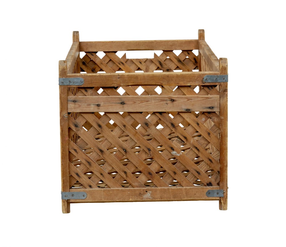A rectangular 19th-century Scandinavian pine log basket with diagonal lattice side panels and iron corner braces. View IV