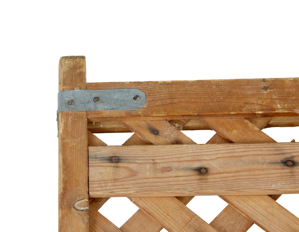 A rectangular 19th-century Scandinavian pine log basket with diagonal lattice side panels and iron corner braces. View VIII
