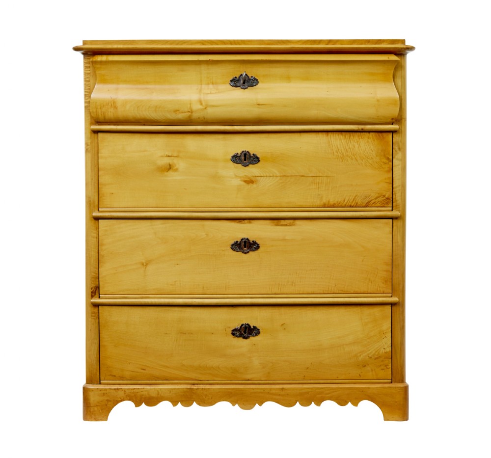 A 19th-century Swedish chest of drawers constructed from honey-toned flame birch with four drawers, keyhole escutcheons, and a scalloped base apron. View VI
