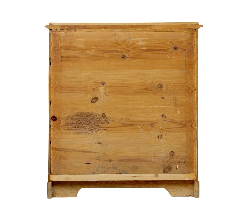 A 19th-century Swedish chest of drawers constructed from honey-toned flame birch with four drawers, keyhole escutcheons, and a scalloped base apron. View VIII