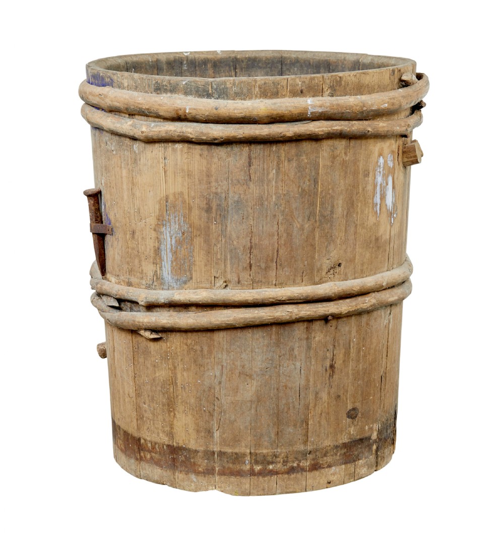 A 19th-century cylindrical Swedish pine barrel featuring hand-bound branch hoops, iron fittings, and remnants of blue paint. View II