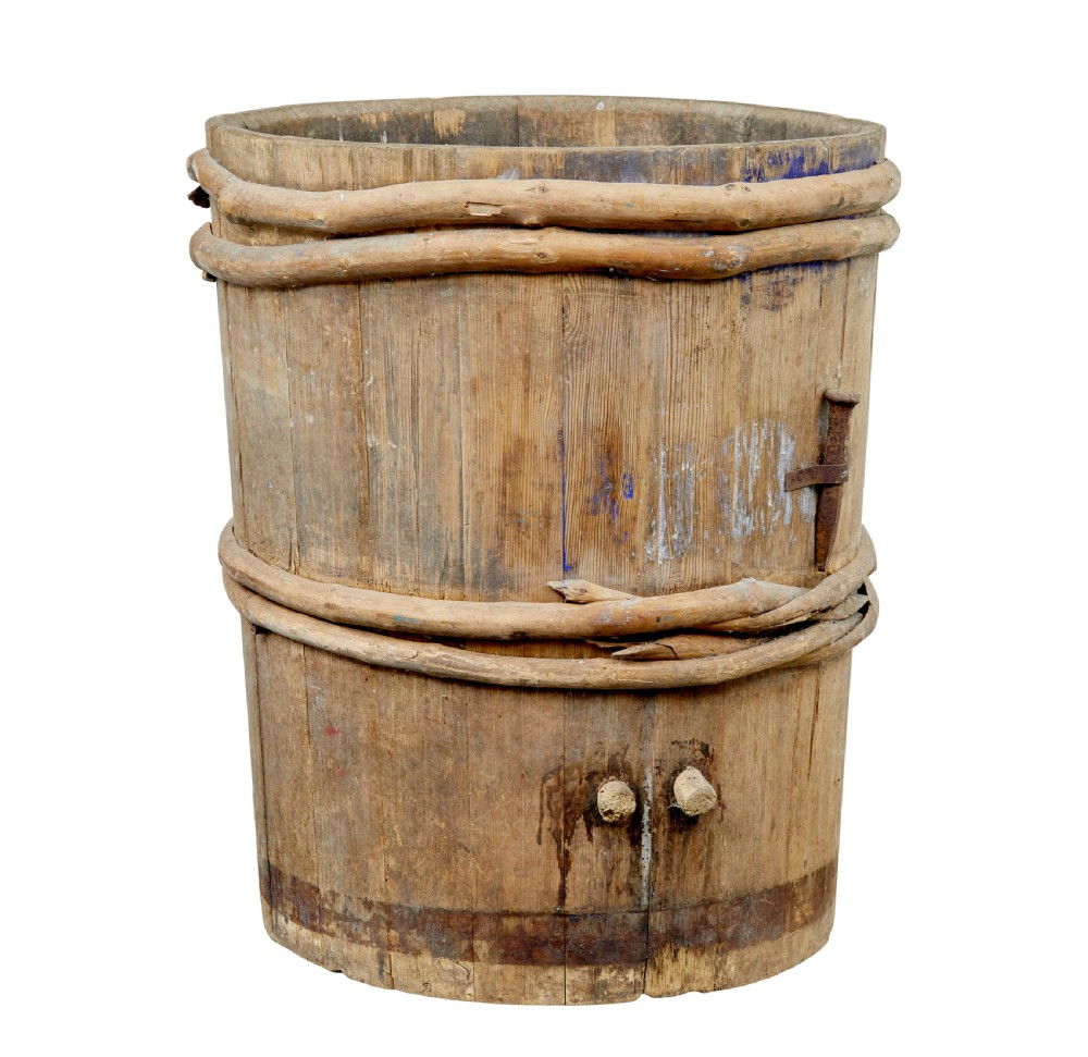 A 19th-century cylindrical Swedish pine barrel featuring hand-bound branch hoops, iron fittings, and remnants of blue paint. View V