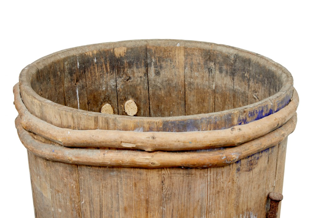 A 19th-century cylindrical Swedish pine barrel featuring hand-bound branch hoops, iron fittings, and remnants of blue paint. View VII