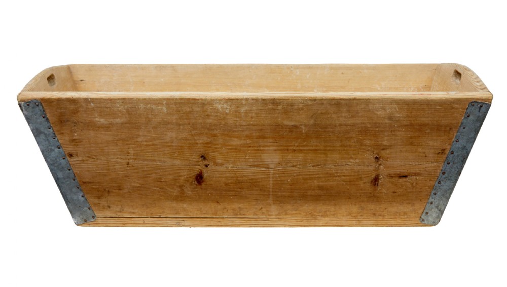 A 19th-century rectangular Swedish pine dough bin featuring tapered sides, metal corner reinforcements, and cut-out handles at each end. View V