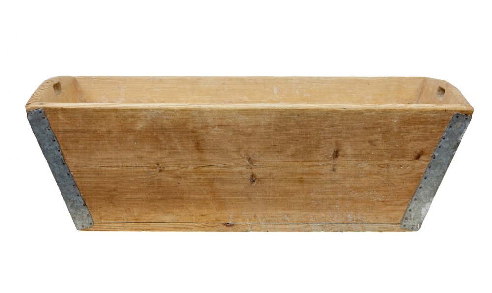 A 19th-century rectangular Swedish pine dough bin featuring tapered sides, metal corner reinforcements, and cut-out handles at each end. View VII