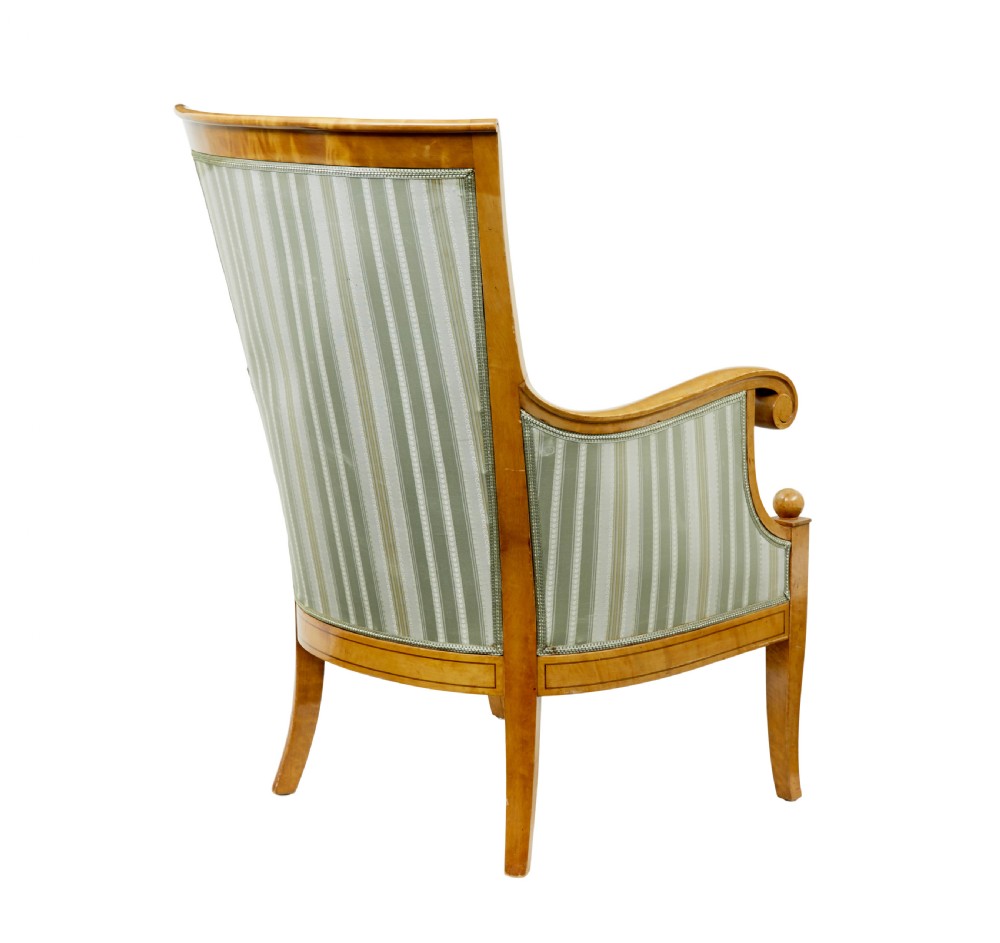 A set of four early 20th-century Karl Johan style birch armchairs featuring scroll arms and green striped upholstery. View VI