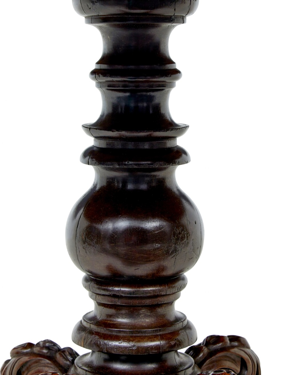 A 19th-century oval wood centre table featuring a flame mahogany veneered top, beaded apron moulding, turned central column, and carved scroll feet. View V