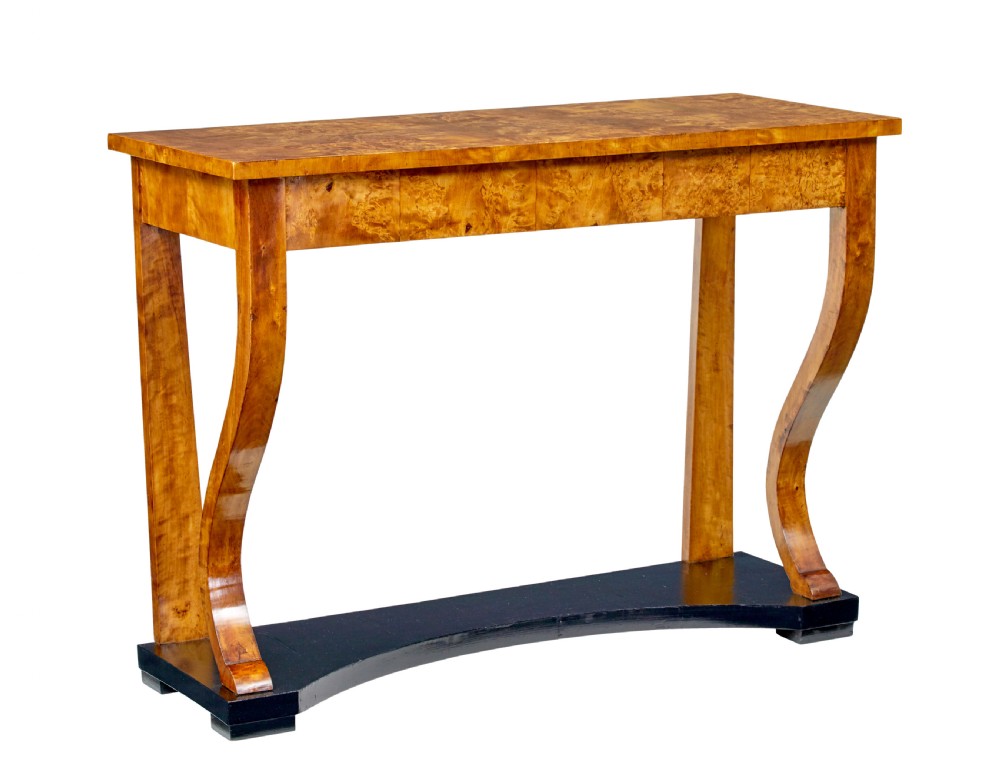A nineteenth-century Empire Revival console table crafted from figured burr birch with curved leg supports and an ebonised plinth base. View VIII