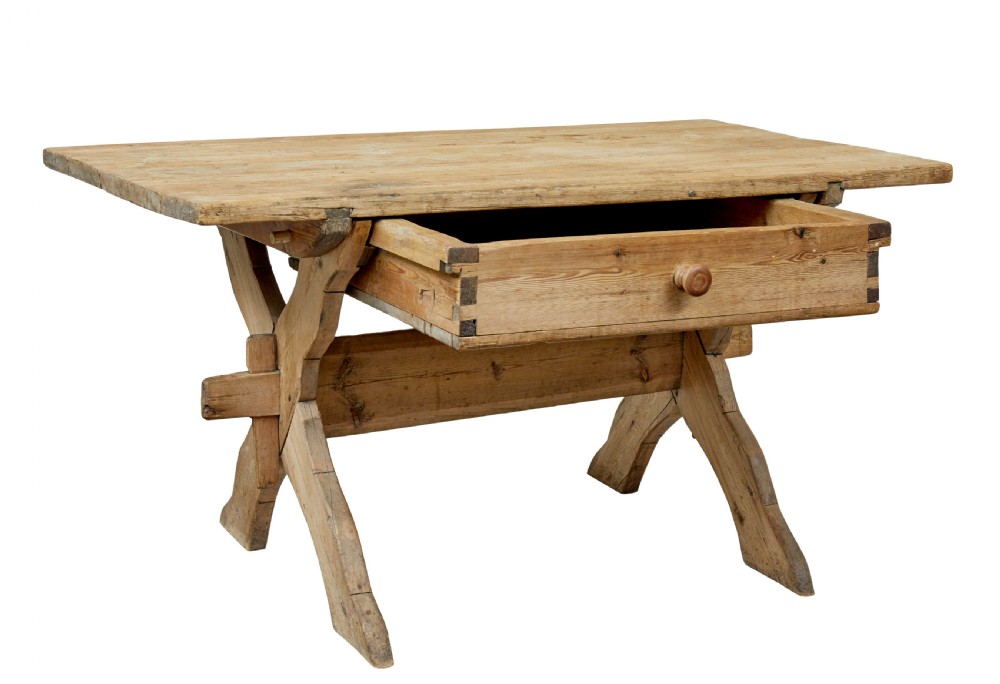 A 19th-century Swedish pine kitchen table featuring an X-frame base with pegged stretcher joints and a single central drawer. View II