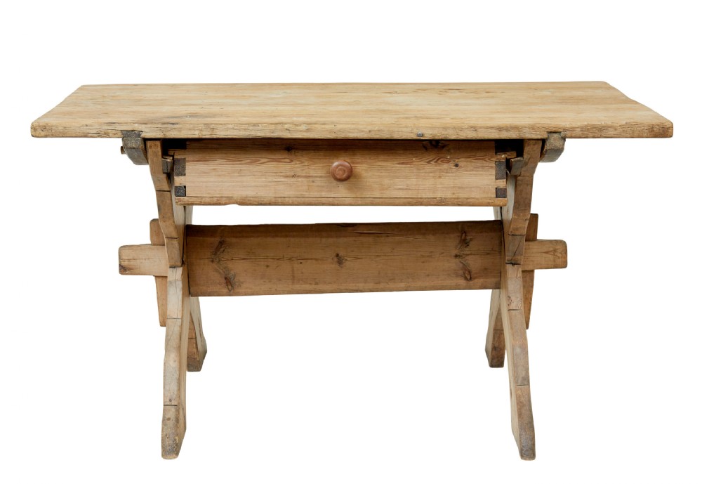 A 19th-century Swedish pine kitchen table featuring an X-frame base with pegged stretcher joints and a single central drawer. View III