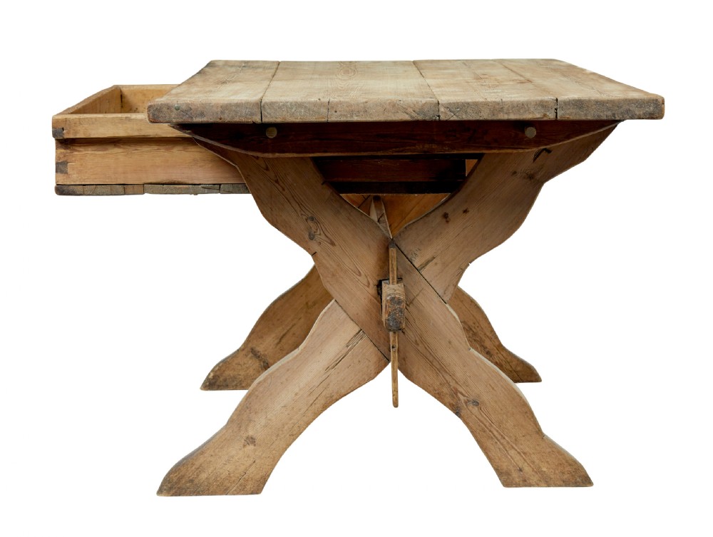 A 19th-century Swedish pine kitchen table featuring an X-frame base with pegged stretcher joints and a single central drawer. View IV