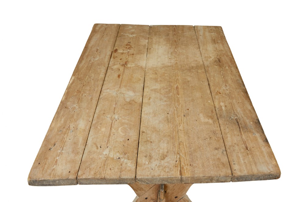A 19th-century Swedish pine kitchen table featuring an X-frame base with pegged stretcher joints and a single central drawer. View VII