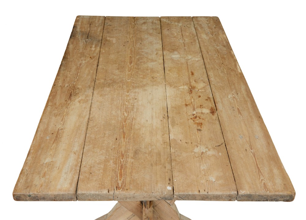 A 19th-century Swedish pine kitchen table featuring an X-frame base with pegged stretcher joints and a single central drawer. View IX
