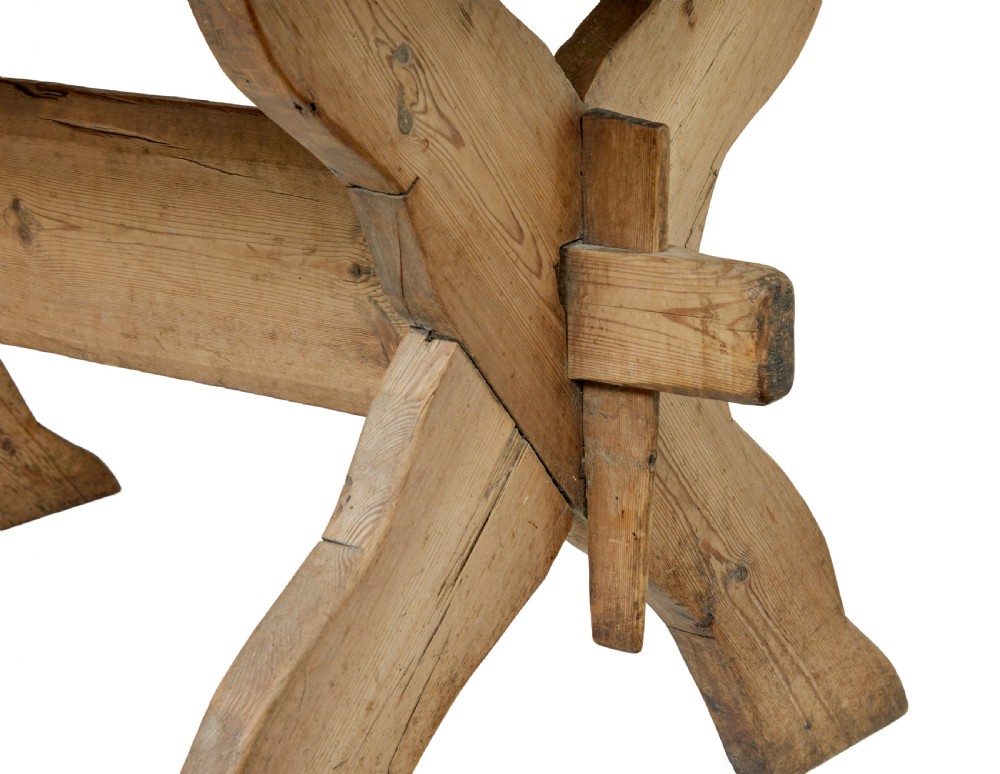 A 19th-century Swedish pine kitchen table featuring an X-frame base with pegged stretcher joints and a single central drawer. View XI