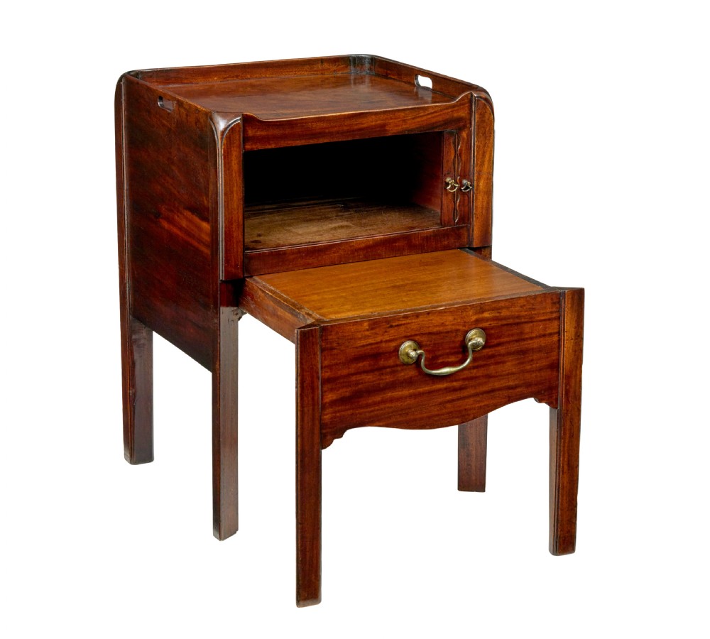 A 19th-century Georgian mahogany bedside table featuring a gallery top with hand-holds, a sliding tambour door, and a drawer with a brass handle. View II