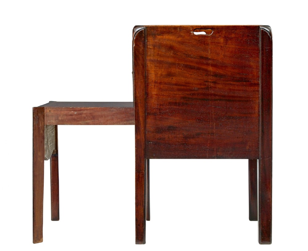 A 19th-century Georgian mahogany bedside table featuring a gallery top with hand-holds, a sliding tambour door, and a drawer with a brass handle. View IV