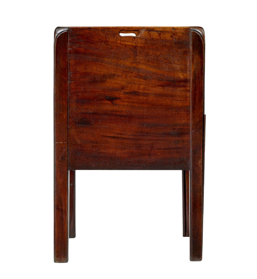 A 19th-century Georgian mahogany bedside table featuring a gallery top with hand-holds, a sliding tambour door, and a drawer with a brass handle. View VI