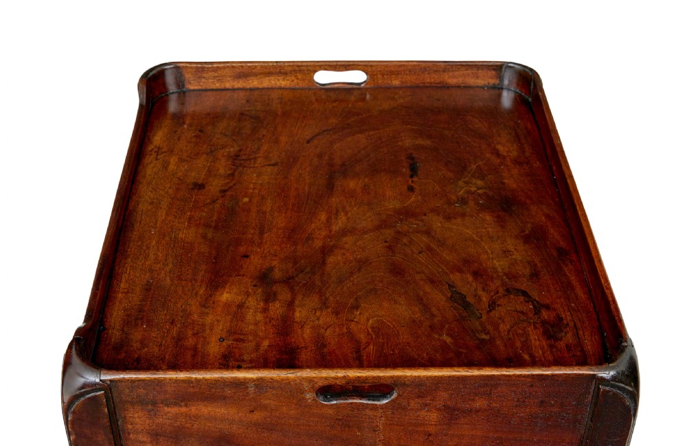 A 19th-century Georgian mahogany bedside table featuring a gallery top with hand-holds, a sliding tambour door, and a drawer with a brass handle. View VIII