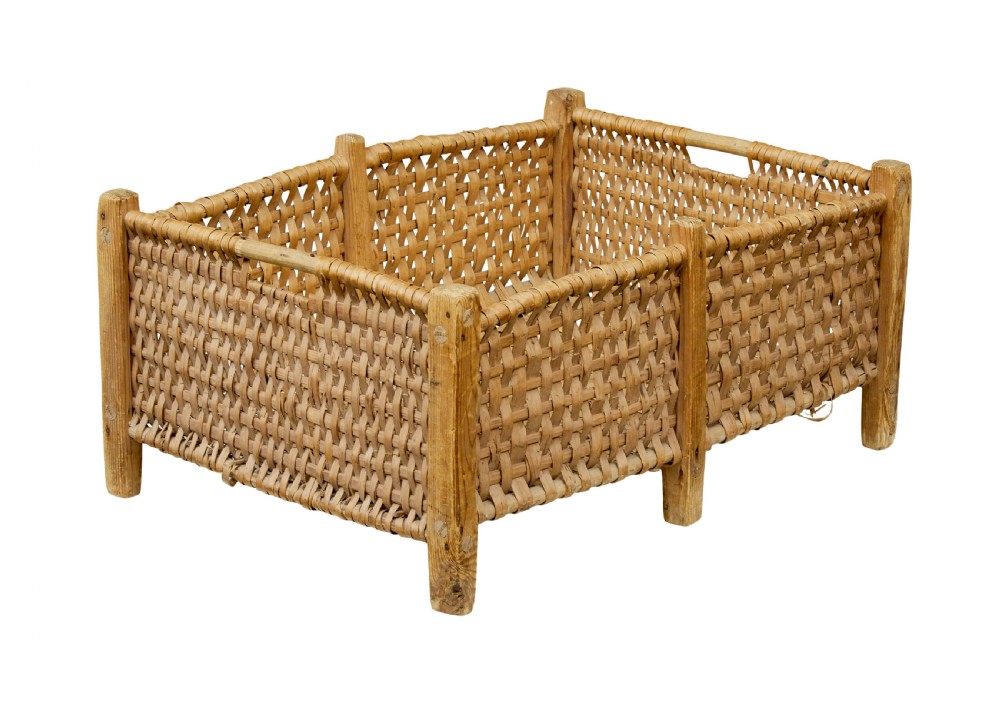 A rectangular 19th-century Scandinavian basket constructed from woven wood splints within a pine corner-post frame.
