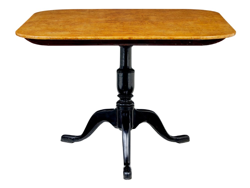 A 19th-century Swedish tripod table featuring a rounded rectangular burr birch top set on a black turned pedestal with three curved legs.