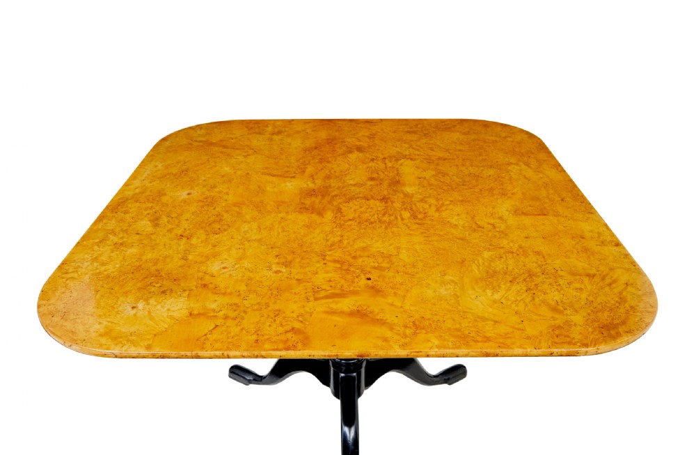 A 19th-century Swedish tripod table featuring a rounded rectangular burr birch top set on a black turned pedestal with three curved legs. View II