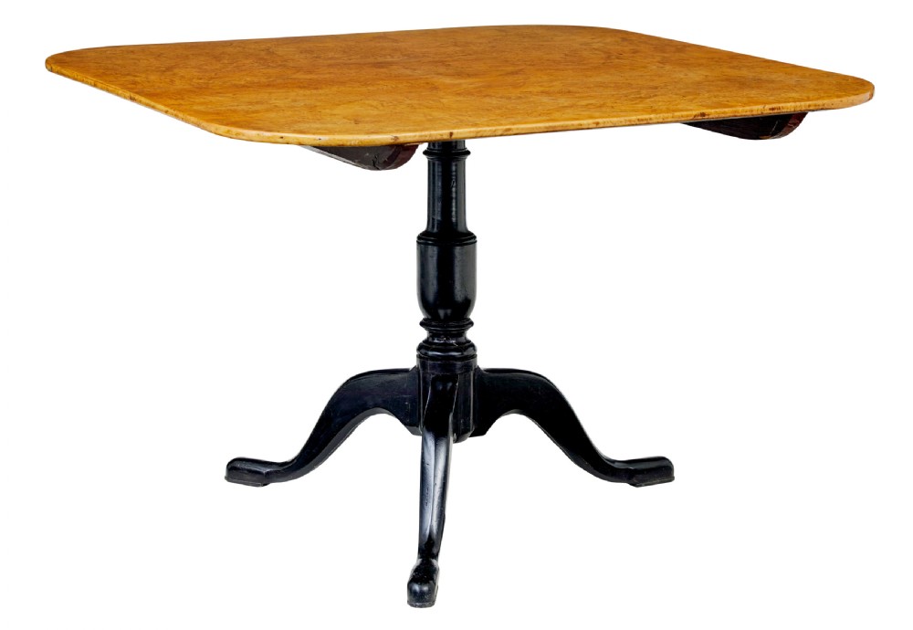 A 19th-century Swedish tripod table featuring a rounded rectangular burr birch top set on a black turned pedestal with three curved legs. View VII
