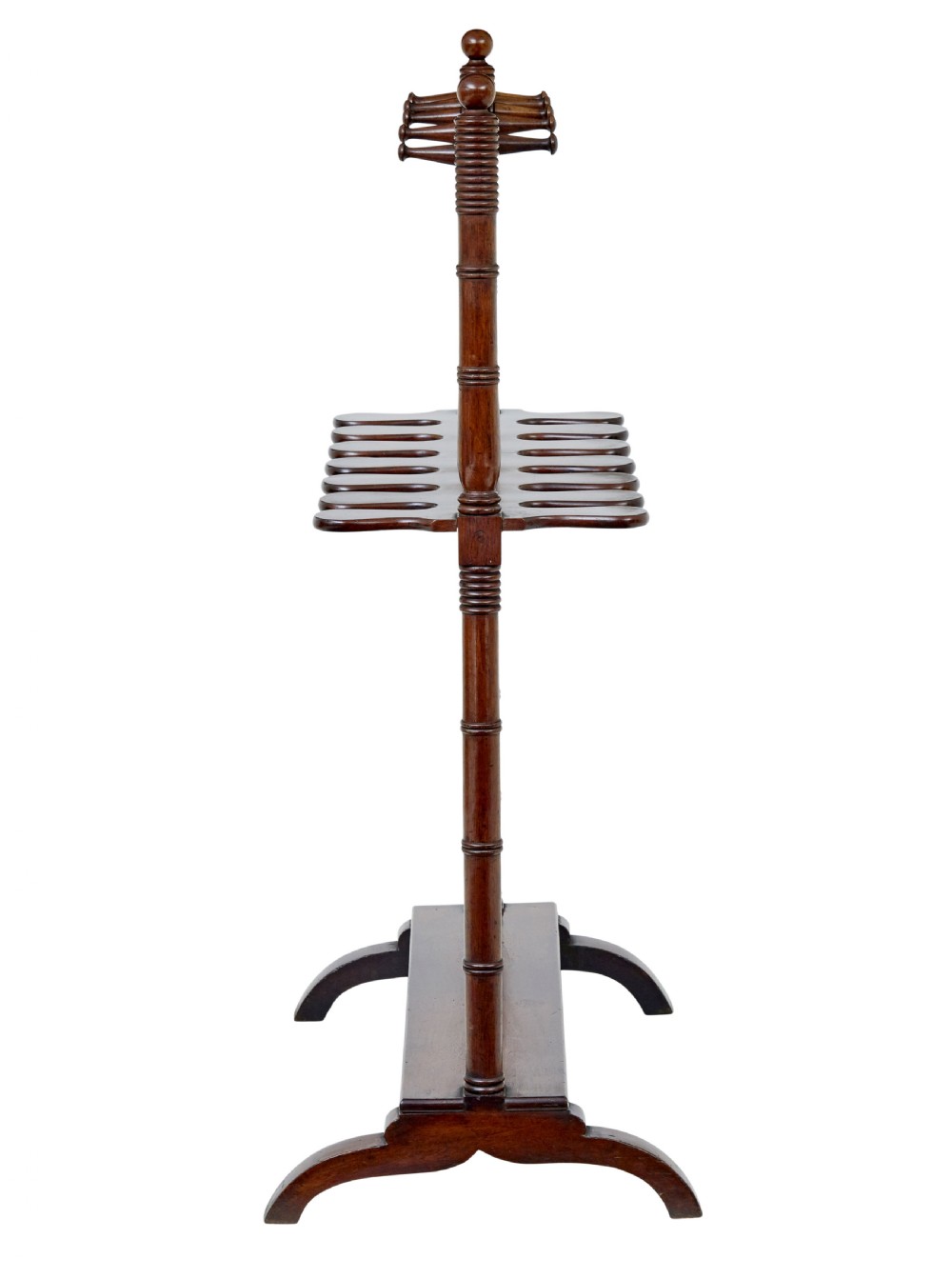 A mid-nineteenth-century dark mahogany wooden riding boot stand featuring turned side supports, upper hanging pegs, a notched central rack, and splayed feet. View VII