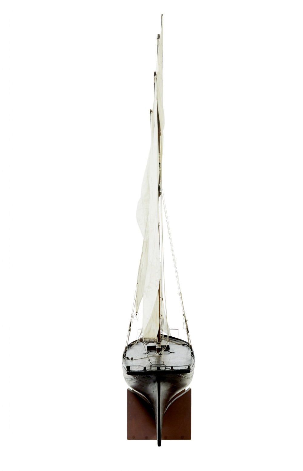A late 19th-century wooden scale model of a two-masted sailing yacht with off-white sails mounted on a wooden stand. View IV