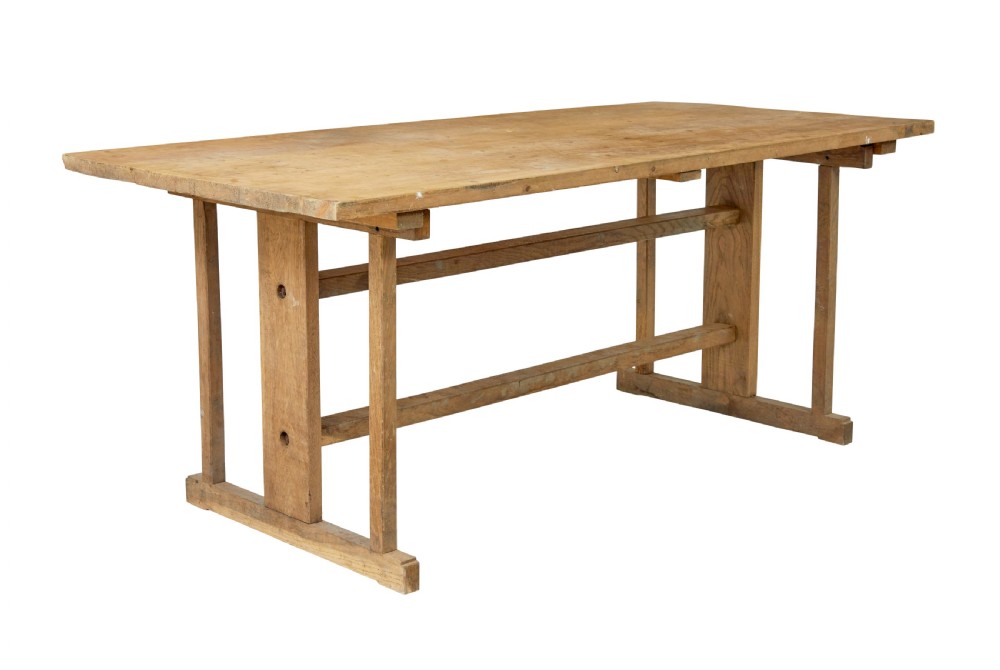 A 19th-century Swedish oak and pine trestle table with a flat rectangular top and timber stretcher base.