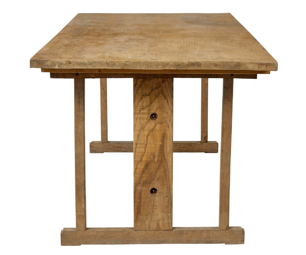 A 19th-century Swedish oak and pine trestle table with a flat rectangular top and timber stretcher base. View IV